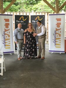 Jessica Sauers receives her award at Celebration Impact