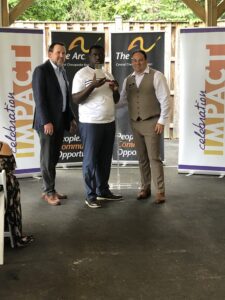 Kojo receives his award at Celebration Impact