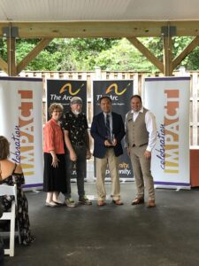 Delegate Mark Chang receives his award at Celebration Impact