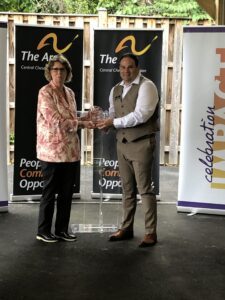 Carol Beatty receives her award at Celebration Impact