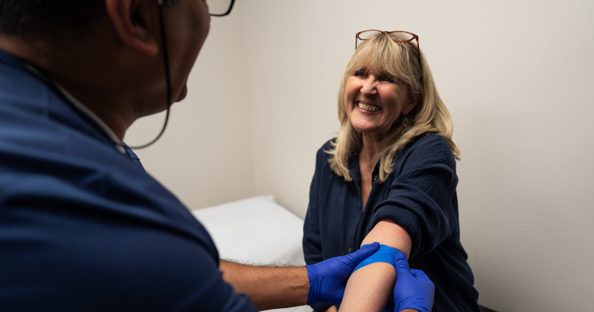 Health Connection Now Open to People We Support - women having her blood drawn by a doctor