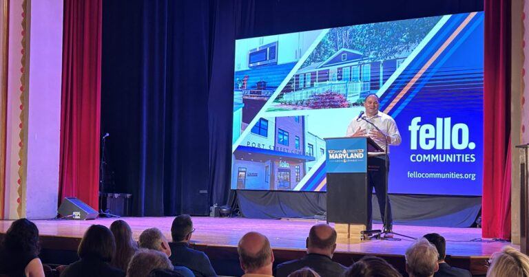 Fello President & CEO Jonathon Rondeau on a stage give a speech