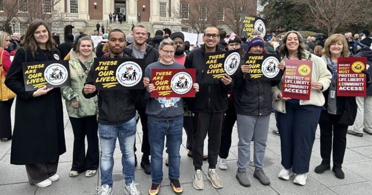 Large group of people at a community rally in Annapolis to Save their DDA services