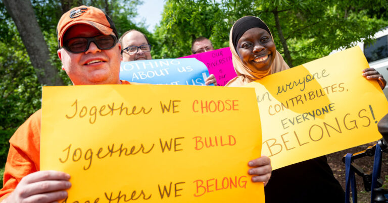 Four people holding up political signs for Maryland's 2026 Legislative session